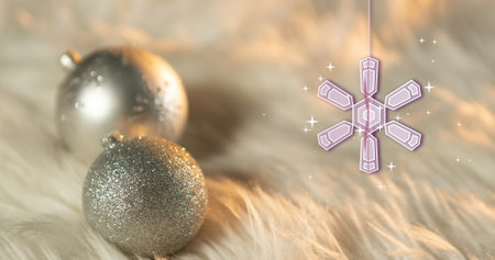 Image of snowflake christmas decorations with baubles on white background. Christmas, tradition and celebration concept digitally generated image.の写真素材