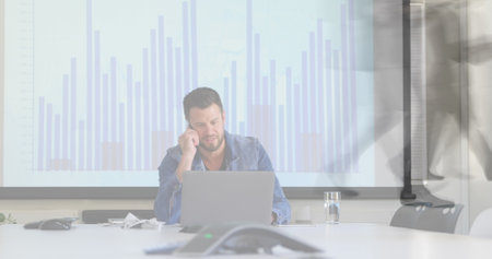 Image of caucasian businessman using computer over data processing and cityscape. Global business, finances, digital interface, computing and data processing concept digitally generated image.の写真素材