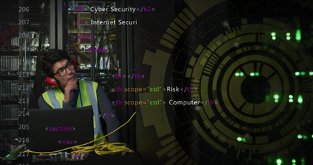 Image of processing circle over asian man working on laptop in server room. network, programming,...