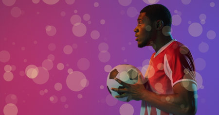 Image of african american male soccer player over spots. Global sport and digital interface concept digitally generated image.の写真素材
