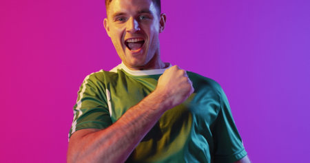 Image of caucasian male soccer player over data processing. Global sport and digital interface concept digitally generated image.の写真素材