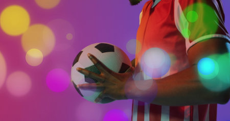 Image of african american male soccer player over spots. Global sport and digital interface concept digitally generated image.の写真素材