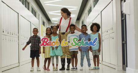 Image of back to school text in rainbow colours over happy diverse female teacher and children....