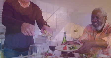 Image of light spots over diverse group of seniors eating. senior home hangout and digital interface concept digitally generated image.の写真素材