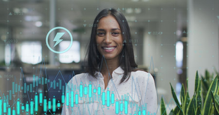 Image of data processing over biracial businesswoman smiling in office. Global business and digital...
