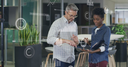 Image of data processing over diverse business people in office. Global business and digital interface concept digitally generated image.の写真素材