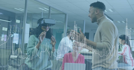 Image of financial data processing over diverse business people using vr goggles in office. Global business, finances, computing and data processing concept digitally generated image.の写真素材