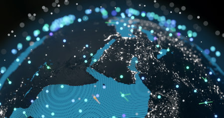 Image of glowing blue mesh of connections spinning over globe and black background. Global...