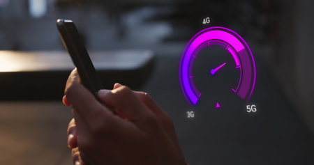 Image of purple speedometer over hands of caucasian man using smartphone. Internet speed, transfer, communication and technology concept digitally generated image.の写真素材