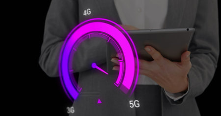 Image of purple speedometer over midsection of caucasian businesswoman using tablet. Internet speed,...
