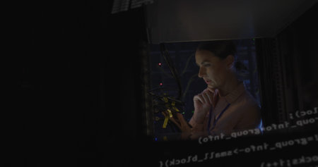 Image of data processing over caucasian female worker in server room. global technology and digital...