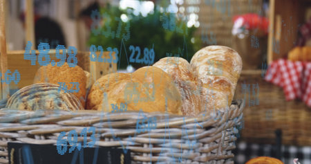 Image of statistics and data processing over bread in baskets in food shop. Business, retail, communication, digital interface, finance and data processing concept digitally generated image.の写真素材