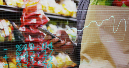 Image of statistics data processing over caucasian male customer in food shop. Business, retail, communication, digital interface, finance and data processing concept digitally generated image.の写真素材