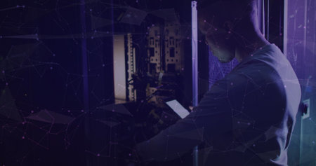 Image of nft text over african american male worker in server room. global technology and digital...