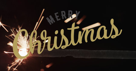 Image of merry christmas text over sparkler on black background. Christmas, tradition and celebration concept digitally generated image.の写真素材