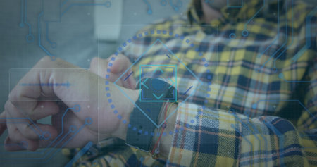 Digital interface with data processing against mid section of man using smartwatch. computer interface and technology conceptの写真素材