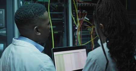 Diverse it engineers and computer servers. Global computing and data processing concept digitally...