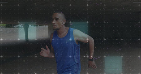 Biracial athlete in mid-stride during outdoor run. His focused expression and athletic gear suggest a rigorous training session.の写真素材