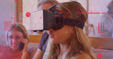 Digital interface with data processing against caucasian girl wearing vr headset at home. computer...