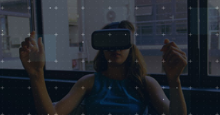Image of white markers moving over woman wearing vr headset and moving her hands. global technology,...