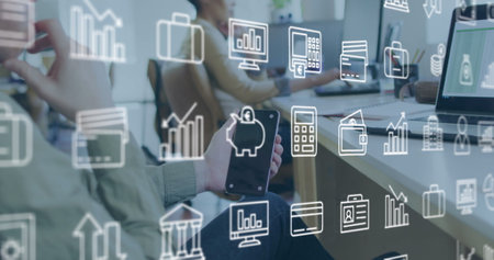 Image of business icons over diverse business people in office. Global business and digital interface concept digitally generated image.の写真素材