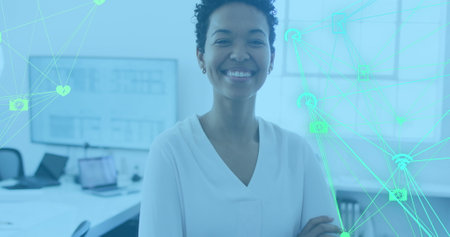 Image of data processing over african american businesswoman smiling in office. Global business and...