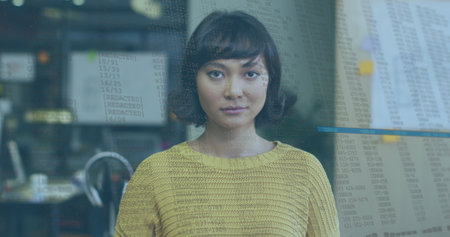 Image of data processing over biracial businesswoman smiling. Global business and digital interface...