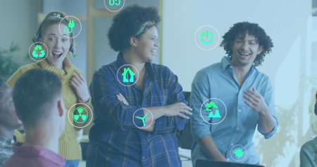 Image of ecology icons over diverse business people in office. Global business and digital interface...