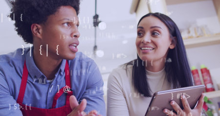 Image of data processing over diverse shop assistant and customer talking. Global business and...
