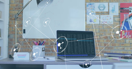 Image of network of conncetions with icons over laptop on desk. Global conncetions, communication...