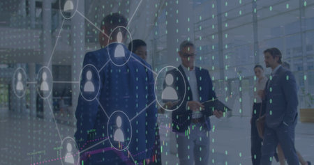 Image of icons and data processing over diverse business people working in office. Global digital...