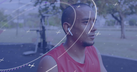 Image of circular scope processing data over male athlete wearing wireless earphones outdoors....