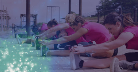 Image of light spots over diverse women at obstacle course exercising. Global sport, health, fitness...