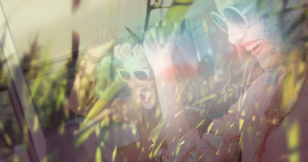 Image of grass moving over smiling women in car on sunny day. nature and harmony concept digitally generated image.の写真素材