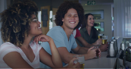Image of happy diverse friends drinking beer. social media and communication interface concept...