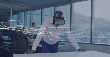 Image of data processing over diverse business people in office. Global business and digital...
