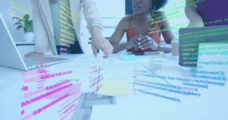 Image of financial data processing over diverse businesswomen in office. Global business, finance, computing and data processing concept digitally generated image.の写真素材