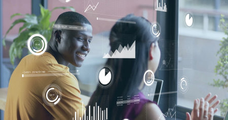 Image of financial data processing over diverse businesspeople in office. Global business, finance, computing and data processing concept digitally generated image.の写真素材