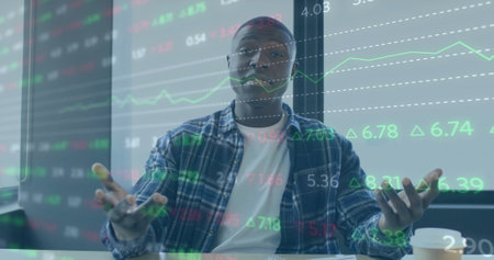 Image of financial data processing over african american businessman working in office. Global...