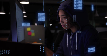 Image of data processing over female hacker using computer. Global connections, computing, digital interface and data processing concept digitally generated image.の写真素材