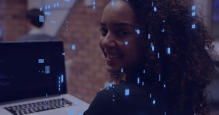 Image of data processing over caucasian woman using laptop. Global connections, computing, digital interface and data processing concept digitally generated image.の写真素材