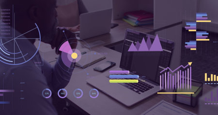 Image of financial data processing over businessman using computer. Global business, finances, computing and data processing concept digitally generated image.の写真素材