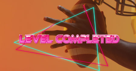 Image of level completed text over neon pattern and african american american football player....