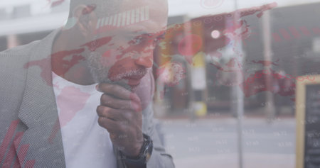 Image of covid 19 cells and world map over african american man drinking coffee. global coronavirus...