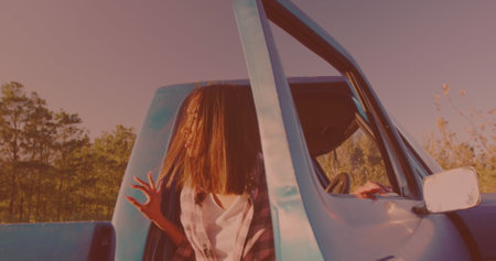 Caucasian woman getting out of the car and opening the hood on the street. Travel and roadtrip conceptの写真素材