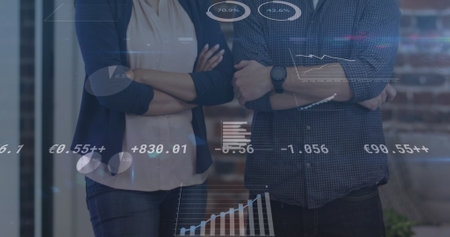 Image of financial data processing over people wearing face masks. global business, finances, connections and digital interface during covid 19 pandemic concept digitally generated image.の写真素材