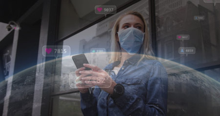 Image of social media icons with numbers over caucasian woman using smartphone. Global social media, technology and digital interface concept digitally generated image.の写真素材