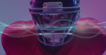 Image of multiple light trails over american football player on neon background. Sports and communication concept digitally generated image.の写真素材