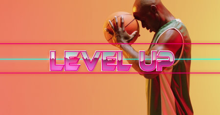 Image of level up text over basketball player on neon background. Sports and communication concept...