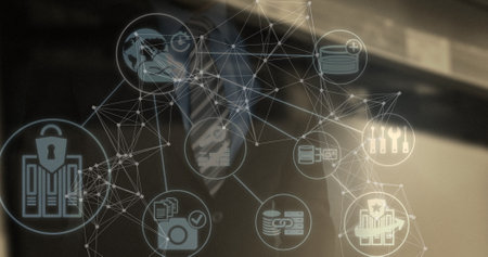 Image of network of connections with icons over caucasian businessman. global business and digital...